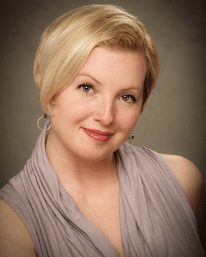 Woman actress with studio strobe lighting headshot.