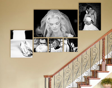 Cluster of wedding images displayed on the wall going up stairs. 