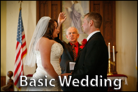 Basic Wedding Package. Minister holding up ring with young couple in small country church.