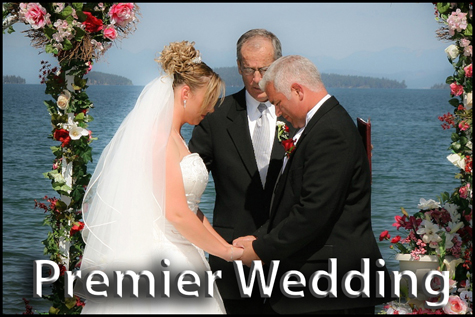 Premier Wedding Package. Couple bowing to each other in prayer on the shore of mountain lake.